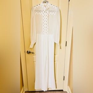 THE SANG stark White Jumpsuit. Size MEDIUM.  NWOT. Xtra buttons Attached.